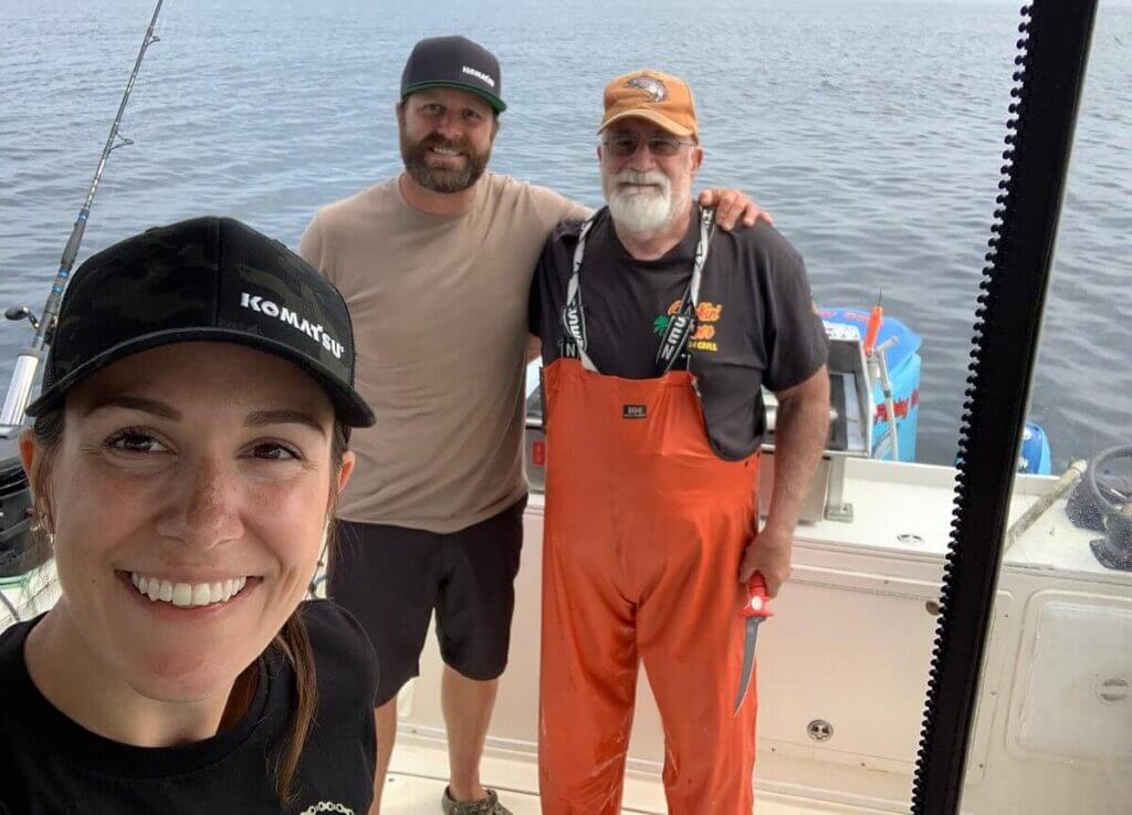 Captain Mark with couple on boat